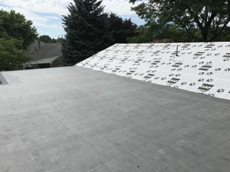 Low slope roof with GAF underlayment showing.
