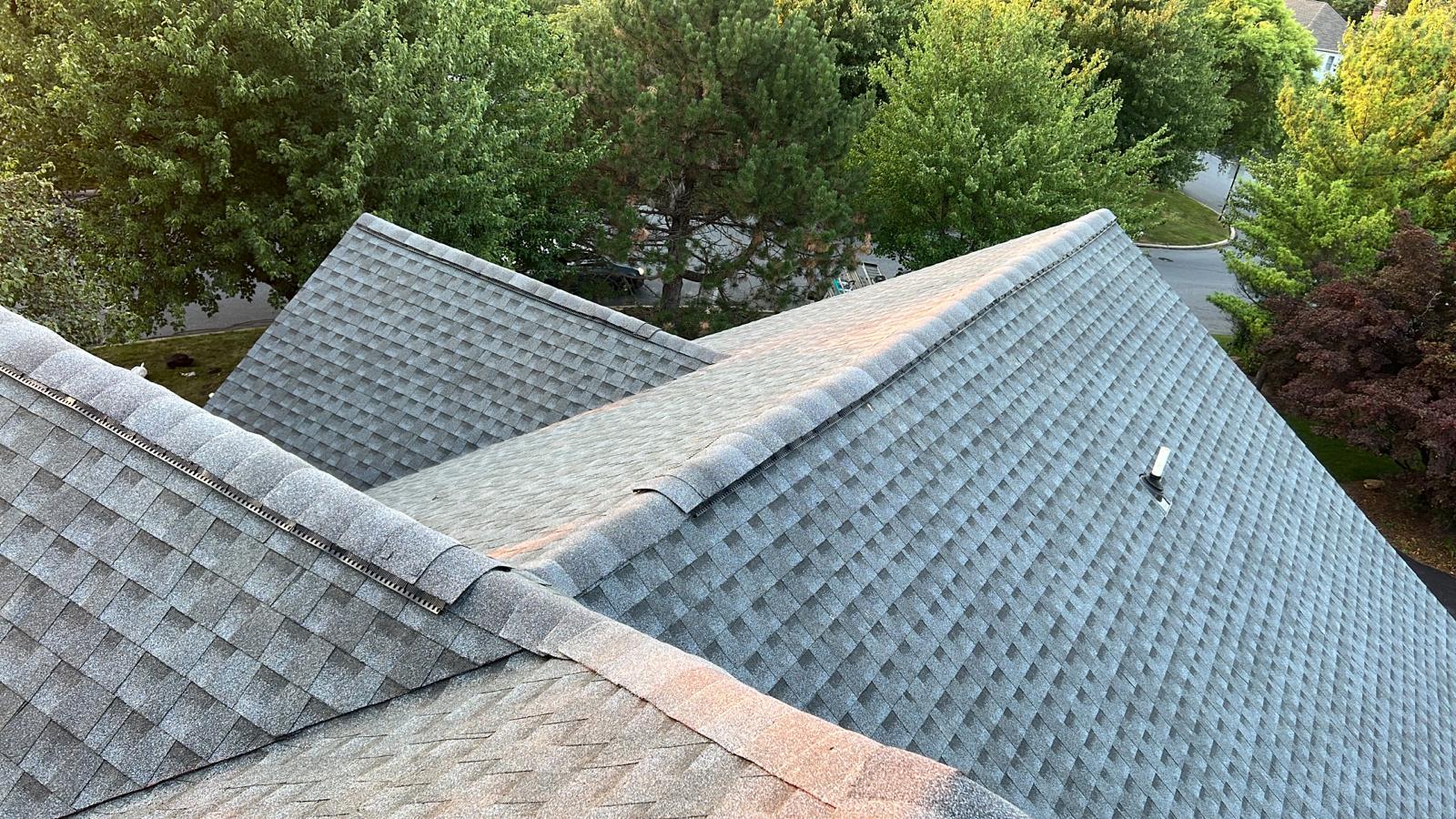 New shingle roof with peaks.
