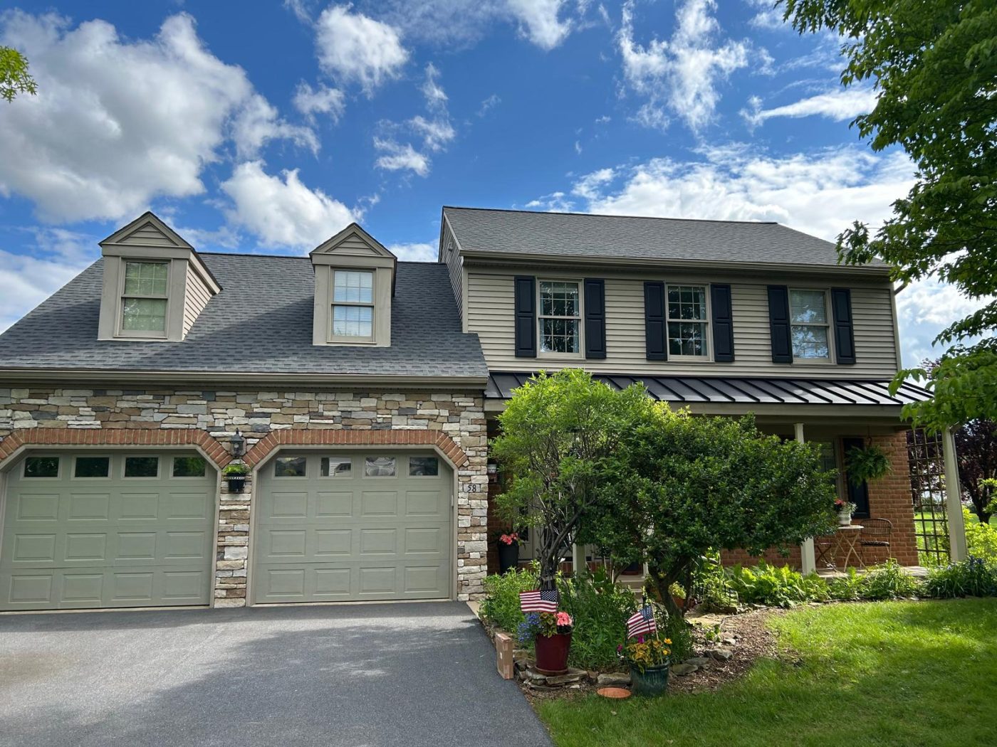 Charcoal GAF Asphalt Shingles with black textured metal Standing Seam accent roof roof replacement in Lititz PA